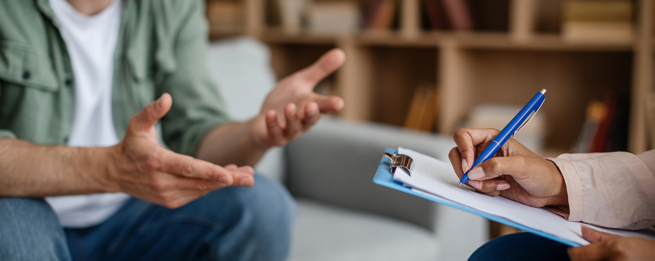 Provider taking notes during a medication management consultation