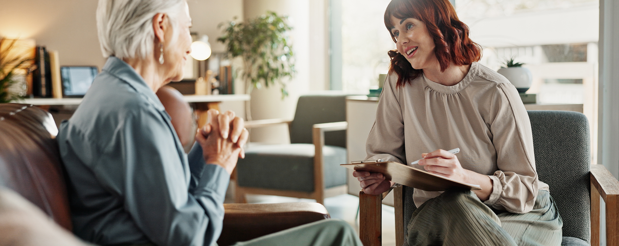 Two women talking during a supportive consultation